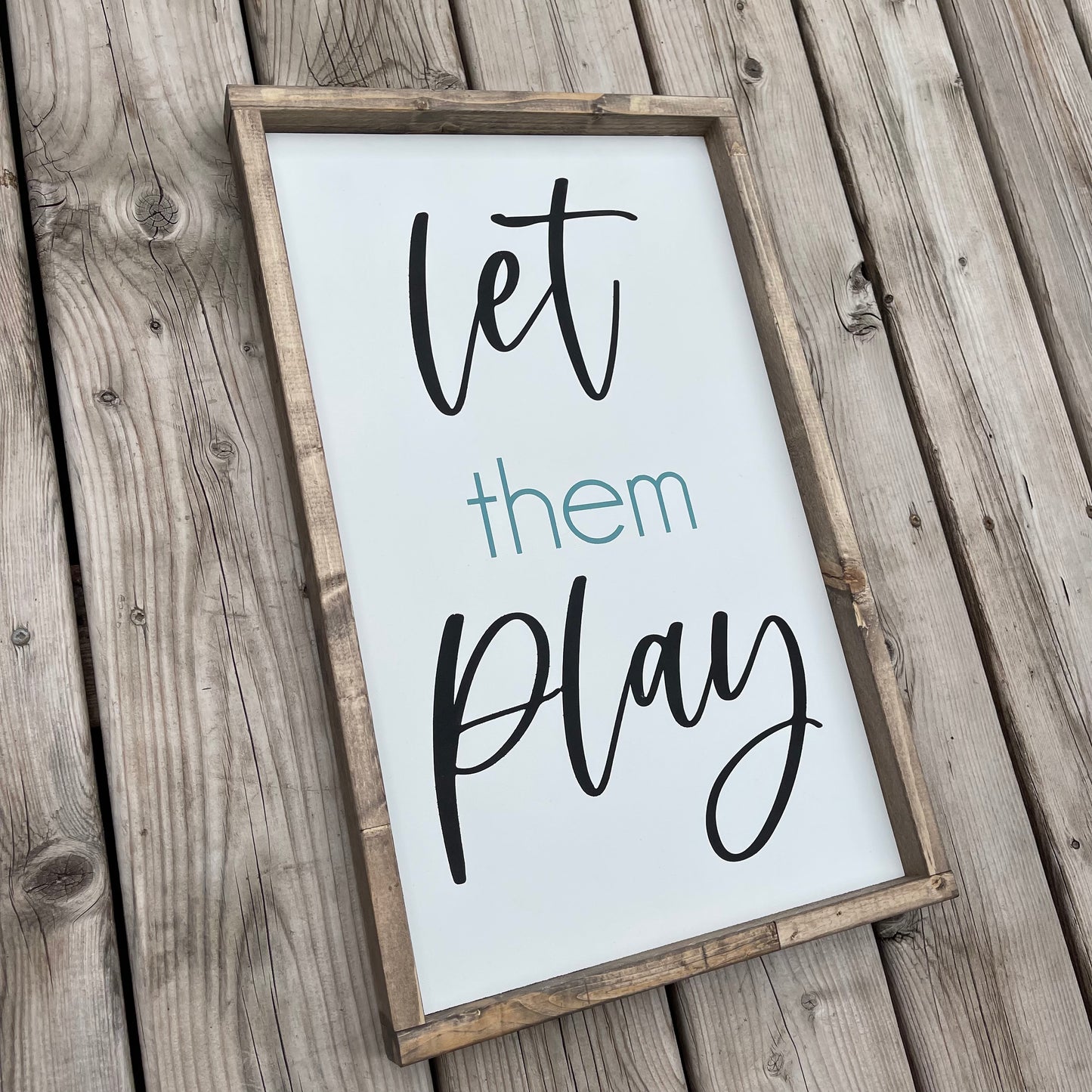 “Let them play” Painted sign